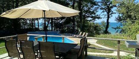 Large deck with view of the pool and Lake Michigan 