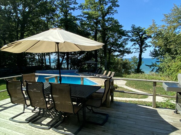 Large deck with view of the pool and Lake Michigan 