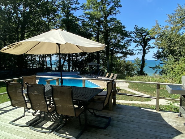Large deck with view of the pool and Lake Michigan 