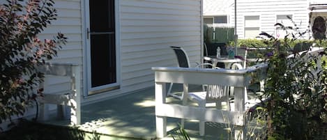 relax after the beach on a comfortable deck with mature gardens