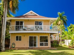 Backside of home with wrap around upper Lanai