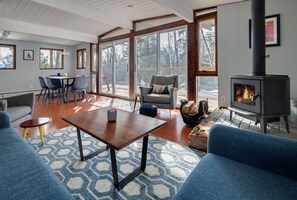 Open floor plan with walls of windows to enjoy the winter weather