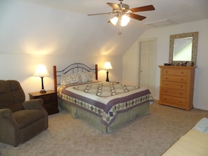 Large upstairs bedroom with Queen bed and adjacent full bath.