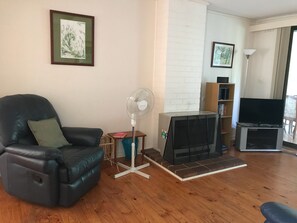 Living room with cozy gas fire in addition to ducted heating. 