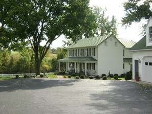 Farmhouse, garages and parking.