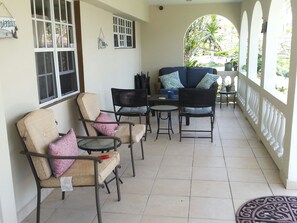 Enjoy sitting and relaxing on our front porch. (Left side shown only)