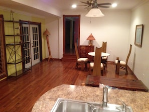 View from kitchen with bedroom door at the far end