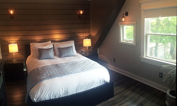 Comfy new queen bed, with plenty of natural (and artificial!) light.