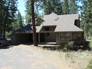 Front of home with carport