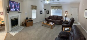 Cozy Living area with leather couch and recliners.  Gas fireplace and 48" TV