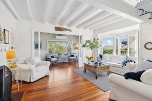 Bright, sunny and breezy, the open living room/sun room area with  ocean views!