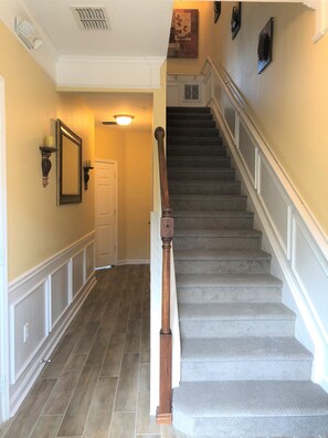 Hallway to the left goes to first floor bedroom with en-suite bathroom