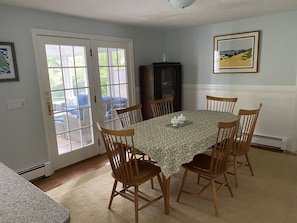 Dining room room opens to kitchen and large screened porch. Ethan Allen furn.