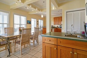 full kitchen, wet bar, dining area and kitchen bar seating. 