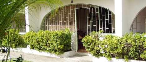 Front of condo and enclosed patio (with security bars).