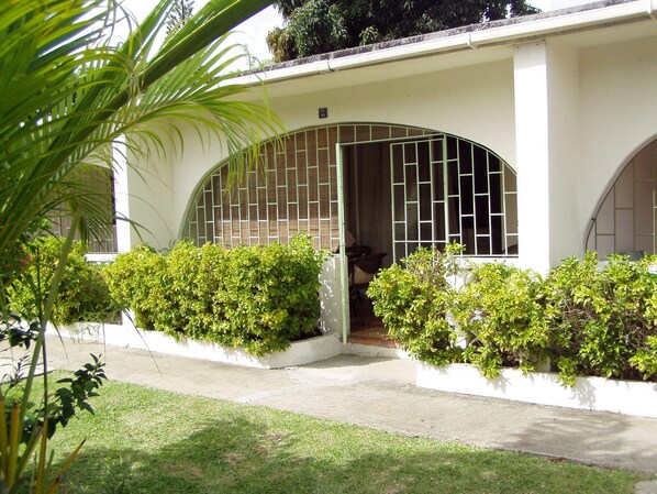 Front of condo and enclosed patio (with security bars).