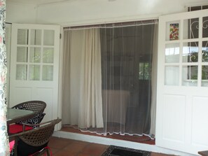 Entrance to condo w. French doors and mosquito netting