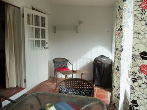 Opposite side patio w. charcoal BBQ unit