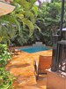 Tropical gardens, very private Pool, lounging and barbeque back patio/porch