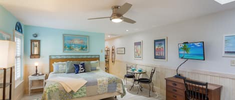 Welcome to this "Key West" themed condo, with large living space - kitchenette is to the right.  TV with Comcast Cable