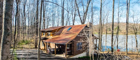 Stunning Lake Front Cabin! On 5 private acres.  Dock and steps into the water