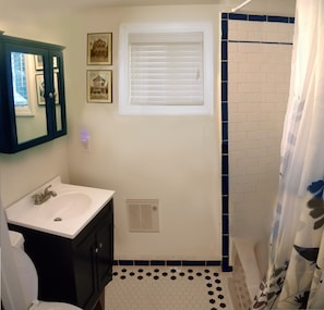 Sweet Pea full bathroom with, shower, tub and plenty of cabinet space