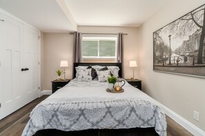 Second bedroom complete with comfortable queen bed and blackout curtains.