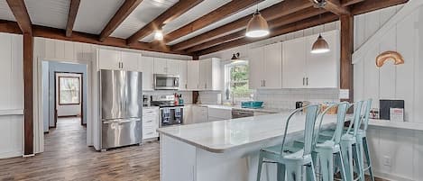 Beautiful open concept kitchen, fully stocked with everything you may need!