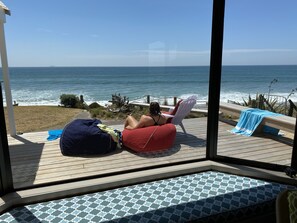 Sit in the sun on the deck or enjoy the window seat inside 