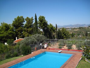 View of pool and surrounding area from the Villa