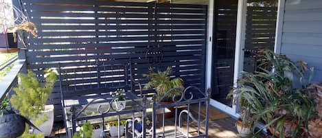 Entry door from gated verandah to Little Finchley