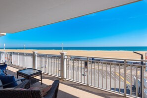 Views from spacious balcony overlooking the ocean and boardwalk