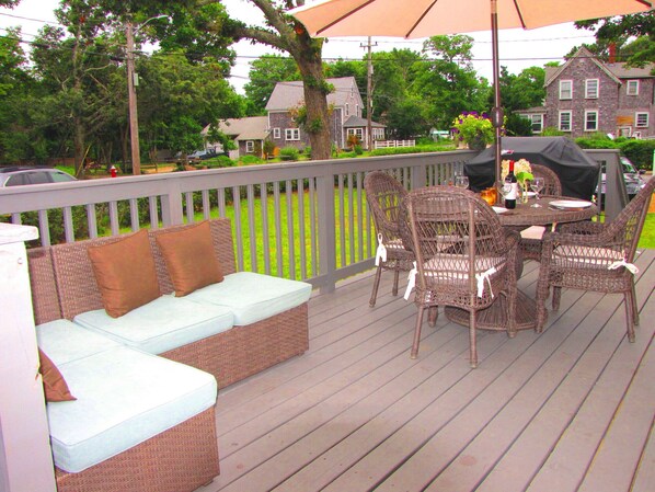 Large deck with couch,dining table & gas grill. Big grassy yard.