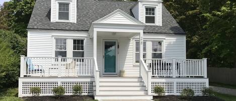 Modern cape with large new front porch