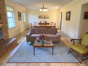 Living Room is comfortably appointed with mid-century furniture and art.