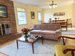 The spacious Living Room has lots of natural light and overlooks the backyard.
