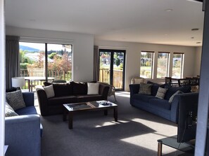 living area, with doors out to the deck