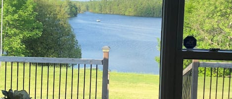 Quiet lake view from the deck.  Go down and sit on the chairs and watch the loons or a kayaker going by.