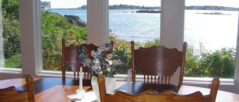 Spectacular views of rocky cove and beach--lobster boats tend their traps.