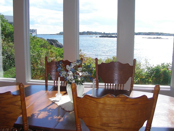 Spectacular views of rocky cove and beach--lobster boats tend their traps.