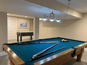 Professional size pool table,  fooseball table & full bathroom in the basement.