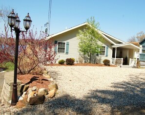 Front of the house and expansive parking area