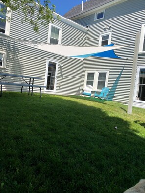 Shade Sails over entry and front yard.