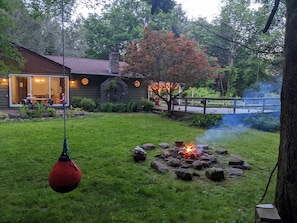 Fireplace, deck and swing.