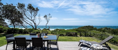 Private north facing beachfront with deck opening directly from lounge room