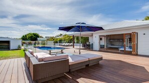 Sun drenched deck with outdoor setting and bbq for entertaining