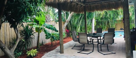 Private tropical paradise with fenced in yard , heated pool and tiki hut