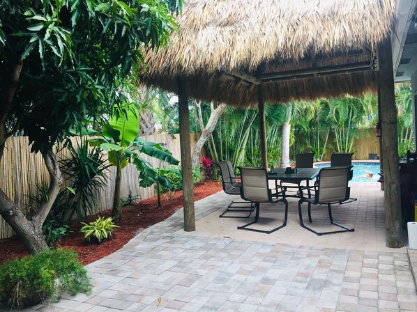Private tropical paradise with fenced in yard , heated pool and tiki hut