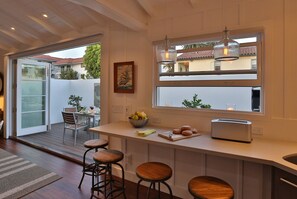 Floating breakfast bar provides extra counter space for the chef