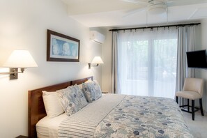 Indulge in comfort and luxury within a bedroom featuring a King-sized bed and a private en suite bathroom